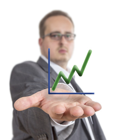 Business man reaches out his arm with a stock exchange graph going upwards  floating over his hand. Isolated on White Backgroundの写真素材