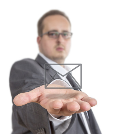 Business man reaches out his arm with an envelope symbol floating over his hand. Isolated on White Backgroundの写真素材