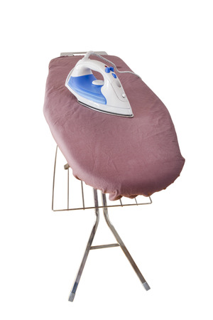 A steam iron on an ironing board isolated on white backgroundの写真素材