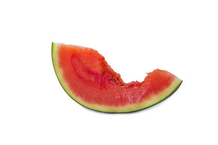 a slice of a watermelon with a piece bitten off isolated on white backgroundの写真素材
