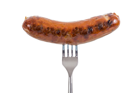 Grilled Sausage on a fork isolated on white backgroundの写真素材