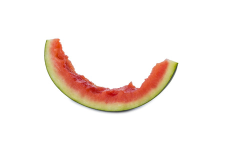 an eaten up slice of a watermelon isolated on white backgroundの写真素材