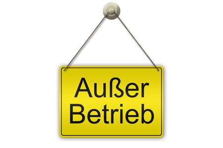 illustration of a yellow sign showing the words Ausser Betrieb (German Out of Order)  isolated on white backgroundの写真素材