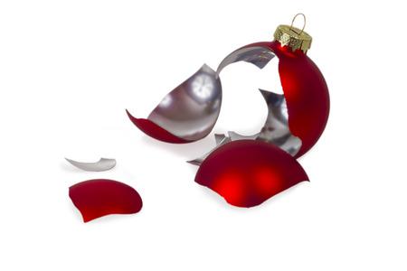 Broken Red Christmas tree ball isolated on white backgroundの写真素材