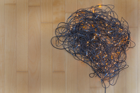 Electric lights need to be unraveled before decorating the christmas tree