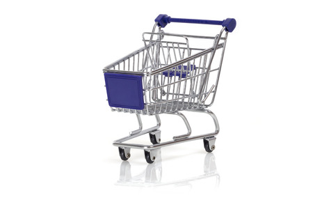 Miniature shopping cart isolated on white backgroundの写真素材