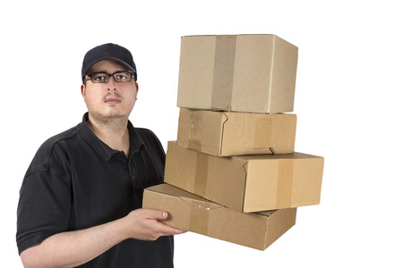 delivery driver in blue uniform with a stack of parcels isolated on white backgroundの写真素材