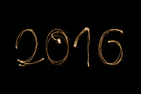 2016 written with a sparkler isolated on black backgroundの写真素材
