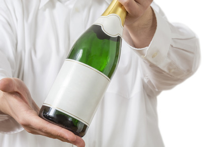 A Waiter in white shirt presenting a Bottle of Champagneの写真素材