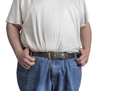 overweight Man in blue jeans and white t-shirt with his hands at his belt isolated on white...
