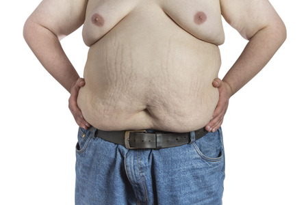 Shirtless overweight Man in blue jeans with hands on his hips isolated on white backgroundの写真素材