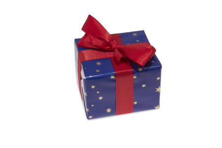 Present in blue wrapping paper with red Ribbon isolated on white backgroundの写真素材