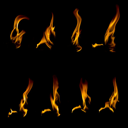 Collection of different types and shapes of flames isolated on black backgroundの写真素材