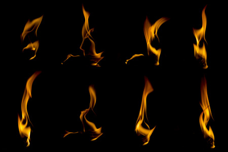 Collection of different types and shapes of flames isolated on black backgroundの写真素材