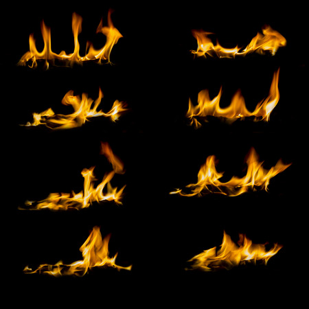 Collection of different types and shapes of flames isolated on black backgroundの写真素材