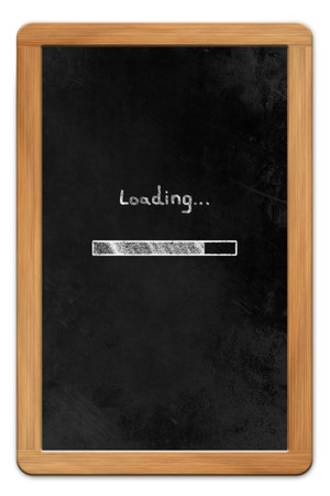 Blackboard with wooden frame and chalk drawn tablet computer loading symbol, isolated on white backroundの写真素材