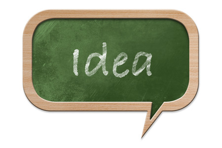 Idea written on a Blackboard in speech bubble shape with wooden frame, isolated on white backroundの写真素材