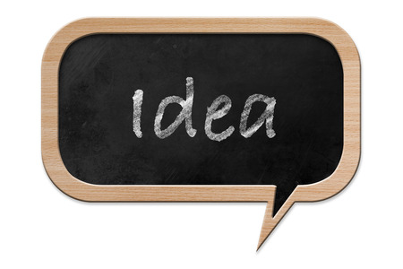 Idea written on a Blackboard in speech bubble shape with wooden frame, isolated on white backroundの写真素材
