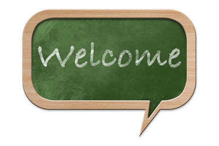 Welcome written on a Blackboard in speech bubble shape with wooden frame, isolated on white backroundの写真素材