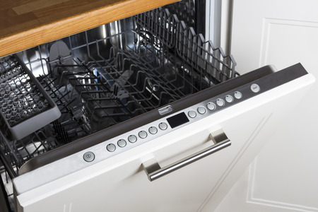 modern Half open empty dishwasher in a modern kitchenの写真素材