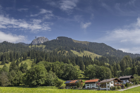 View from a small vilage up to a mountain in the bavarian alpsの写真素材