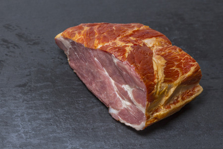 smoked pork chop on a slate plateの写真素材