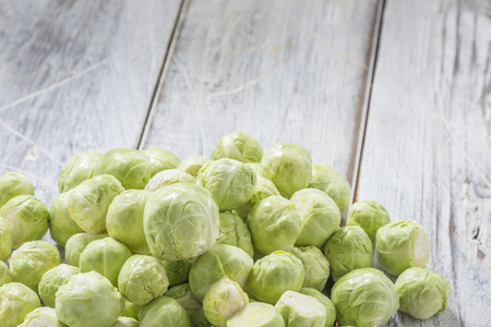 Brussels sprouts on a white wooden tableの写真素材