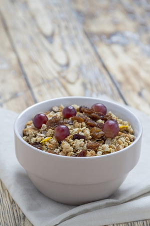 Cereals in a Bowl on a rustic wooden tableの写真素材