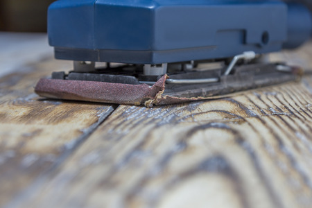 blue grinding machine on rustic wooden surfaceの写真素材