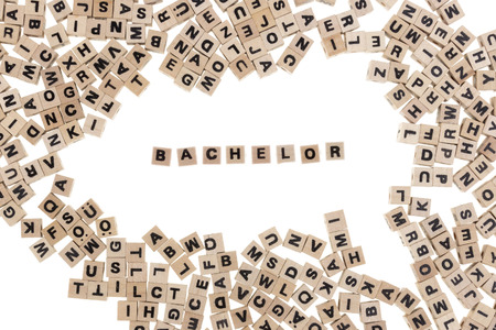 bachelor framed by small wooden cubes with letters isolated on white backgroundの写真素材