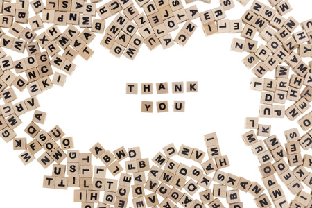 thank you framed by small wooden cubes with letters isolated on white backgroundの写真素材