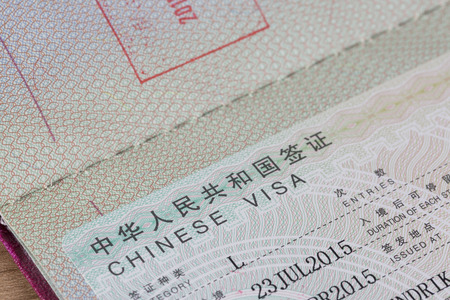 Detail view of chinese visa in a passport with stampのeditorial素材