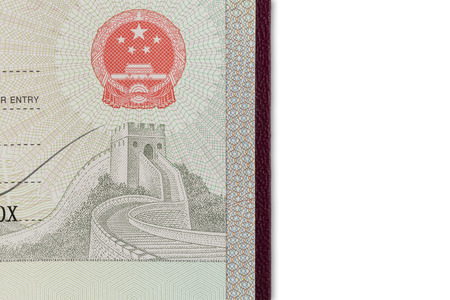 Detail view of chinese visa in a passport isolated on white backgroundの写真素材