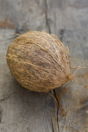 Coconut on rustic wooden tableの写真素材