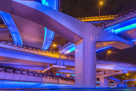 Illuminated bridges of the elevated highway system at nightの写真素材