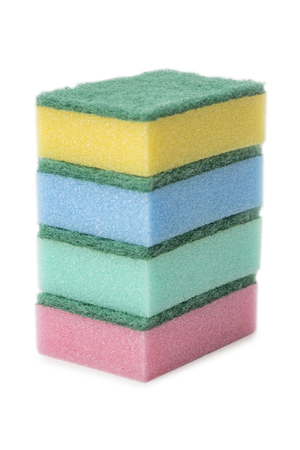 Stack of kitchen sponges in different colors isolated on white backgroundの写真素材