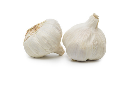 Two Garlic bulbs isolated on white backgroundの写真素材