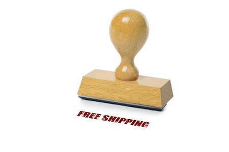Free Shipping printed in red ink with wooden Rubber stamp isolated on white backgroundの写真素材