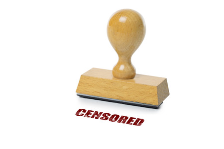 Censored  printed in red ink with wooden Rubber stamp isolated on white backgroundの写真素材