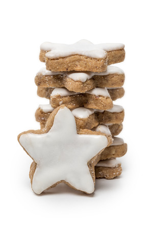 Cinnamon Stars christmas cookies with icing isolated on white backgroundの写真素材