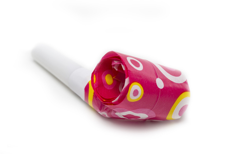 Red Party blower with dots isolated on white backgroundの写真素材
