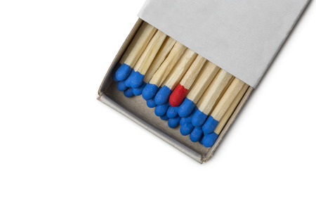 Matchbox with blue and one red matches isolated on white backgroundの写真素材
