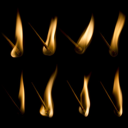Collection of burning matches isolated on black backgroundの写真素材