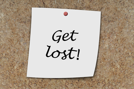 Get Lost written on a memo pinned on a cork boardの写真素材