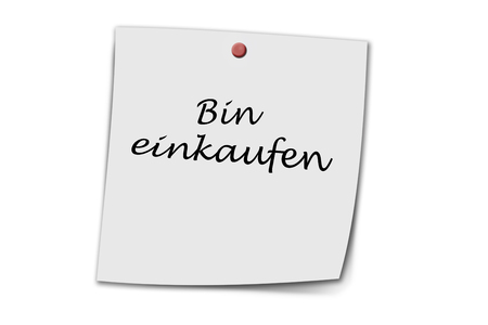 bin einkaufen (german went shopping) written on a memo, isolated on whiteの写真素材