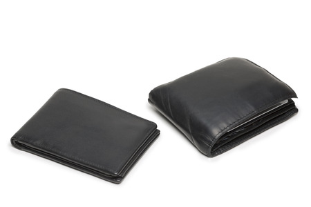 Small empty and a big full wallet with dollar notes and debit cards isolated on white background