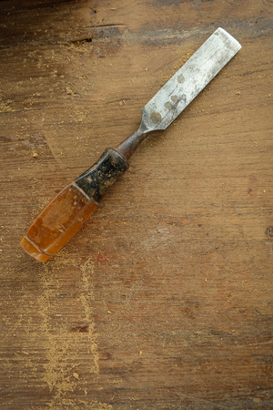 Chisel  on wood tableの写真素材