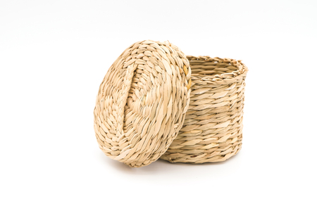 woven straw basket isolated on white backgroundの写真素材