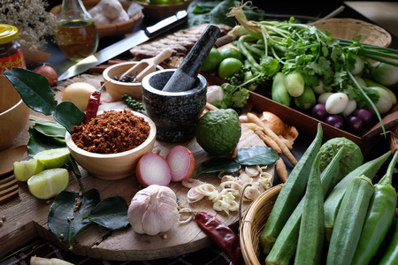 Assortment of Thai food Cooking ingredients. Spices ingredients chilli pepper garlicgalanga and kaffir lime leaves.の写真素材