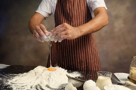 making bread from eggs and flour.